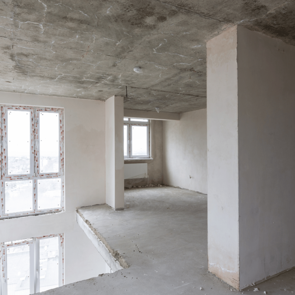 Unfinished second story addition with bare walls and concrete floors.